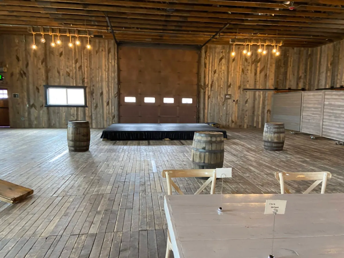 Barn seating and tables arranged around the second stage
