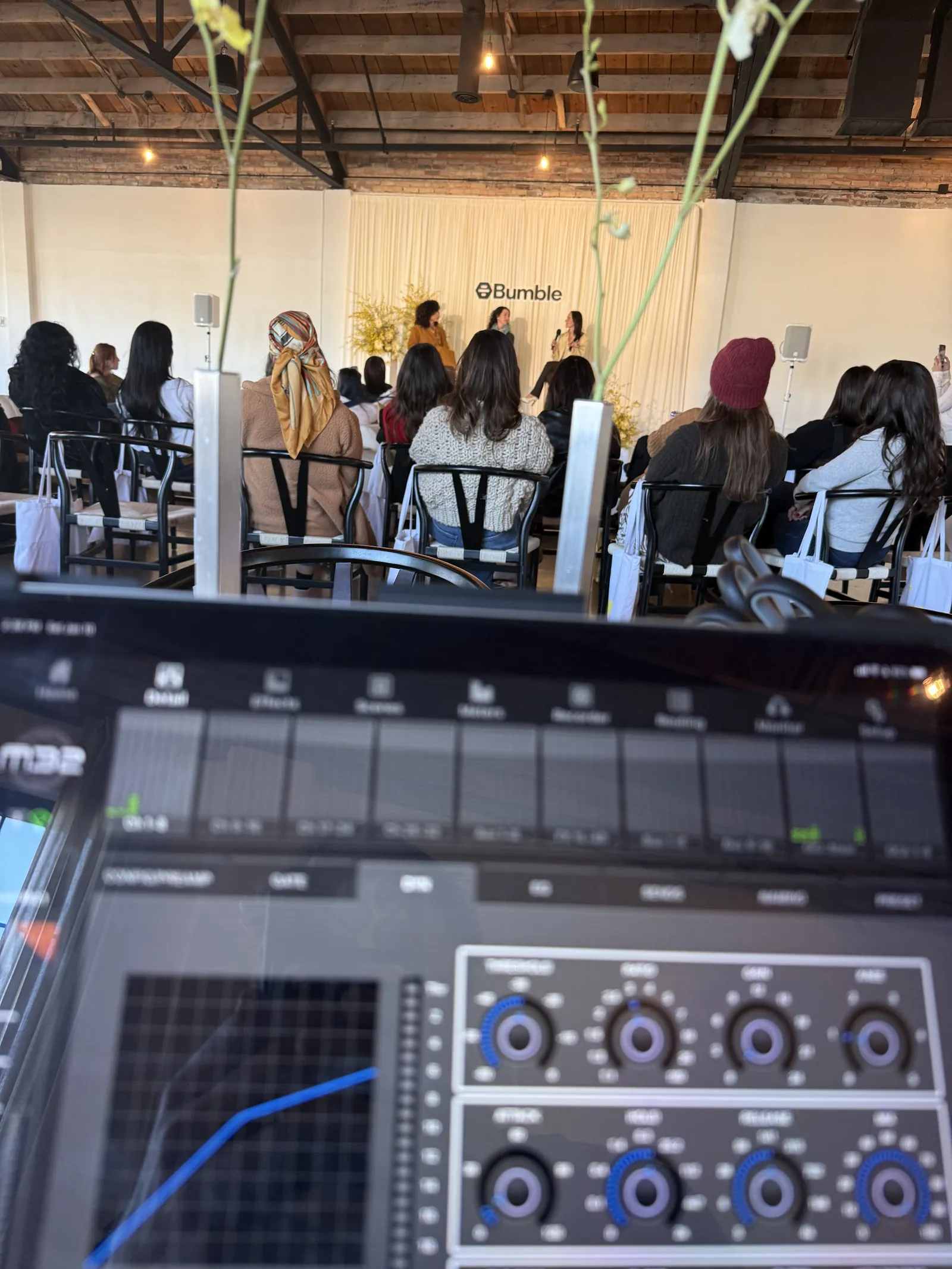Mix position at a corporate panel with an iPad controlling the wireless microphone channels