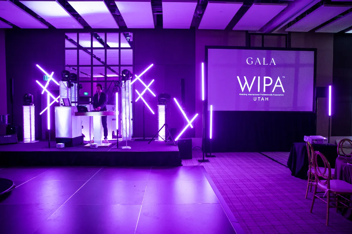 Gala stage with screen and uplighting ready for presenters