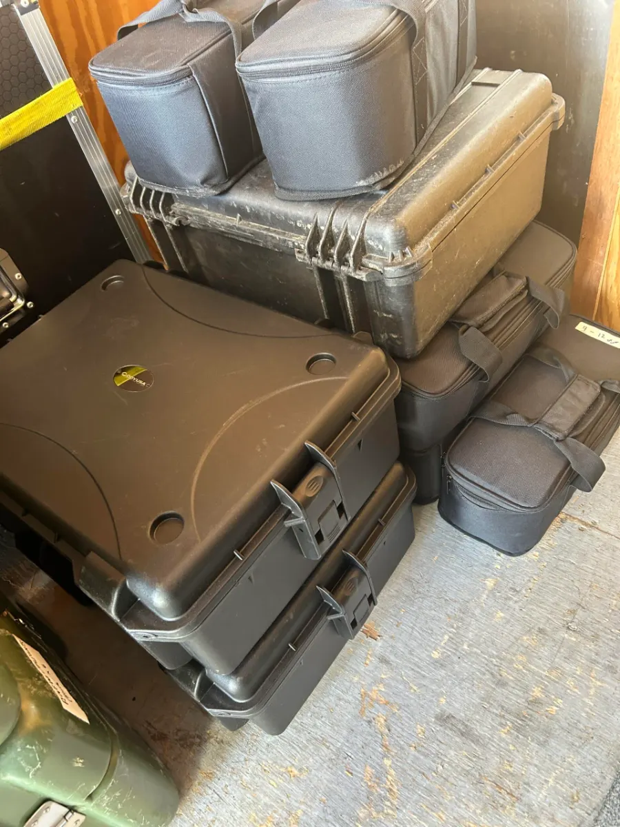 Road cases and equipment bags staged for a Park City rental delivery