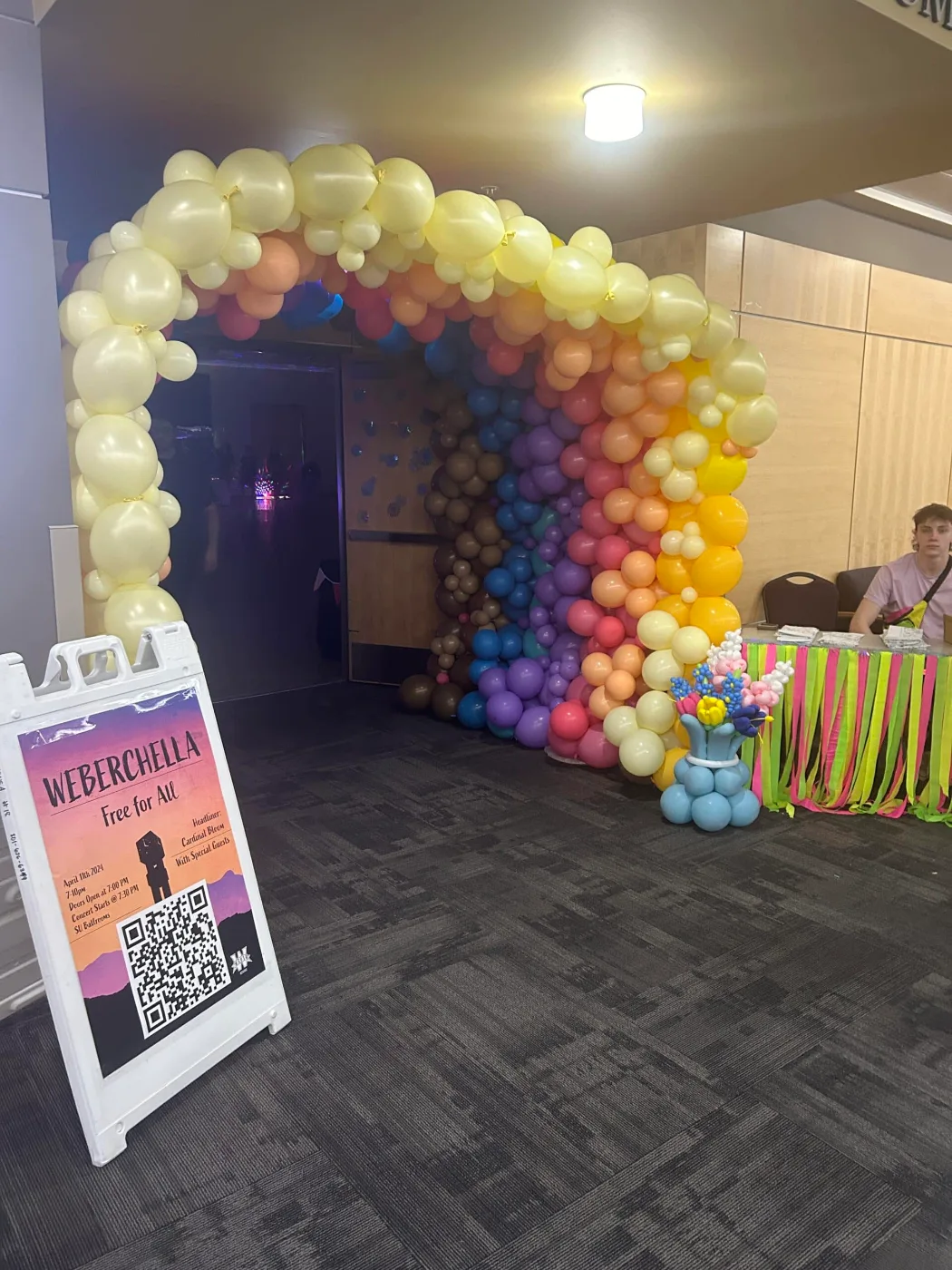 WeberChella entrance with a balloon arch and an A-frame event sign at Weber State University