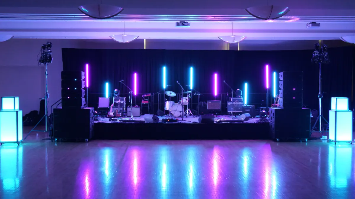 WeberStock stage in the Weber State ballroom lit with purple and blue uplighting