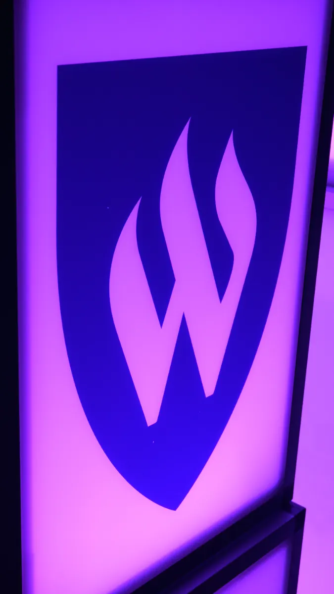 Illuminated Weber State W lightbox on the ballroom stage