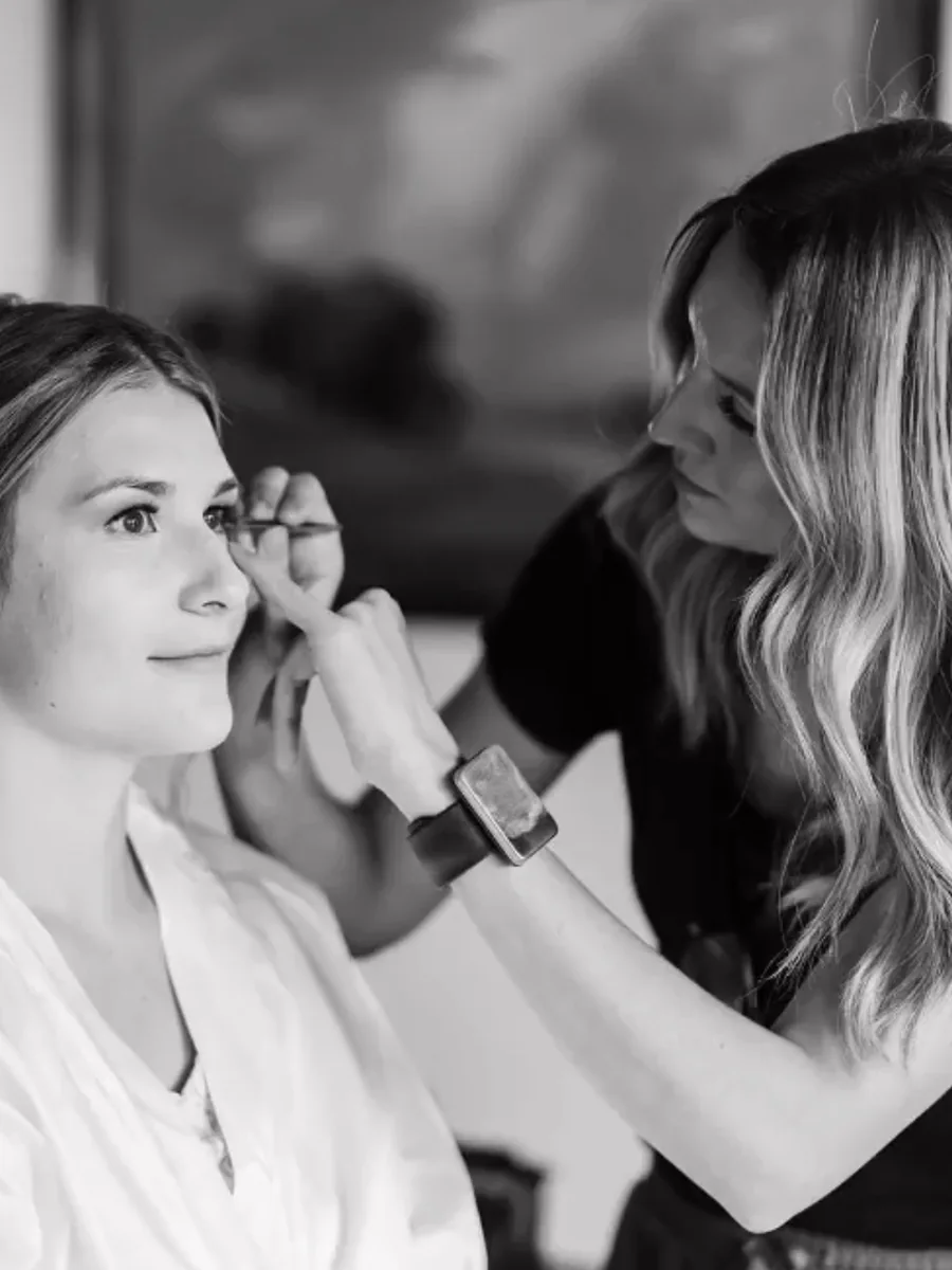 Heather McKell applying makeup on location before an event