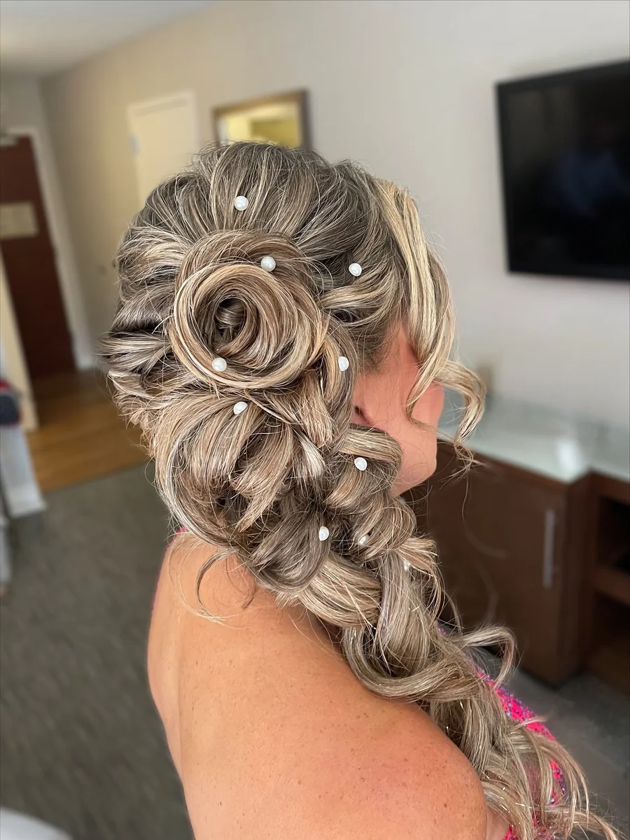 Braided rose updo with pearl pins, styled by Heather Dear Artistry